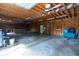 Attached garage featuring wood construction, concrete floors and Coors Light decorations at 3804 65Th E St, Bradenton, FL 34208