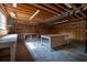 Attached garage featuring wood construction, concrete floors, and work tables at 3804 65Th E St, Bradenton, FL 34208