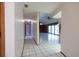 Hallway with tiled floors leading to an open living area and bedrooms at 3804 65Th E St, Bradenton, FL 34208