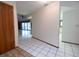 Bright hallway with tiled floors leading to the living room and kitchen at 3804 65Th E St, Bradenton, FL 34208