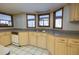 Well-lit kitchen featuring gray countertops, ample cabinetry, and modern faucet at 3804 65Th E St, Bradenton, FL 34208