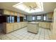 Expansive kitchen with ample cabinetry, an island, and abundant counter space at 3804 65Th E St, Bradenton, FL 34208
