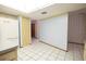 Bright kitchen features white tile floors, neutral countertops, and updated appliances at 3804 65Th E St, Bradenton, FL 34208