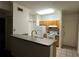 Functional kitchen features white appliances and tiled flooring at 4207 S Dale Mabry Hwy # 6308, Tampa, FL 33611