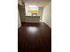 Open floor plan with dark wood flooring and light walls at 4207 S Dale Mabry Hwy # 6308, Tampa, FL 33611