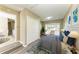 Well-lit bedroom featuring light gray floors and a closet with large, sliding doors at 444 Flamingo Dr, Apollo Beach, FL 33572