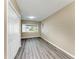 An empty bedroom featuring light gray floors and a closet with large, sliding doors at 444 Flamingo Dr, Apollo Beach, FL 33572