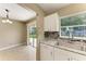 Open floor plan featuring an eat-in kitchen with stainless steel appliances and sliding door access to backyard at 444 Flamingo Dr, Apollo Beach, FL 33572