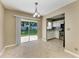Bright kitchen features modern appliances, tile flooring, and a sliding door to the outside at 444 Flamingo Dr, Apollo Beach, FL 33572