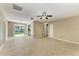 Expansive living room with tile floors, offering a versatile space for various furniture arrangements and activities at 444 Flamingo Dr, Apollo Beach, FL 33572