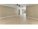 Spacious living area featuring neutral walls and tile flooring, ready for personalization and comfort at 444 Flamingo Dr, Apollo Beach, FL 33572