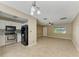 Open-concept floor plan showcases a kitchen with stainless steel appliances and an adjacent living room at 444 Flamingo Dr, Apollo Beach, FL 33572