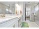 A light, bright bath features a double sink vanity with lots of counterspace and a glass shower at 4540 Terrazza Ct, Bradenton, FL 34211