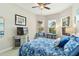 Beautiful bedroom features a floral pattern, ceiling fan, and bright natural light through the windows at 4540 Terrazza Ct, Bradenton, FL 34211