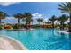 Relaxing community pool surrounded by lush tropical landscaping and inviting lounge areas at 4540 Terrazza Ct, Bradenton, FL 34211