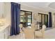Cozy dining area with a view of the pool and an open concept floor plan at 4540 Terrazza Ct, Bradenton, FL 34211