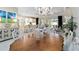 Spacious dining room featuring a wood table and views of the open-concept living area at 4540 Terrazza Ct, Bradenton, FL 34211