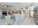 Bright, modern kitchen with stainless steel appliances, and a large island at 4540 Terrazza Ct, Bradenton, FL 34211