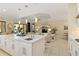 Bright, open kitchen with a large island, modern appliances, and seamless access to living space at 4540 Terrazza Ct, Bradenton, FL 34211