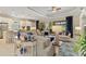 Open-concept living room and kitchen with modern finishes and plenty of natural light at 4540 Terrazza Ct, Bradenton, FL 34211