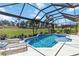 Beautiful pool and spa area with a screened enclosure and lush landscaping, perfect for relaxing outdoors at 4540 Terrazza Ct, Bradenton, FL 34211