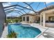 Stunning screened-in pool area with a spa and plenty of room for outdoor entertaining at 4540 Terrazza Ct, Bradenton, FL 34211