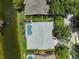 Birds eye view shows private pool, adjacent canal and manicured landscaping at 4733 Spring Meadow Ln, Sarasota, FL 34233
