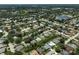 Aerial view of the community showing residences bordering canals and featuring private pools at 4733 Spring Meadow Ln, Sarasota, FL 34233