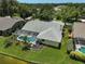 Aerial view showcasing property with screened in lanai, and water access at 4733 Spring Meadow Ln, Sarasota, FL 34233