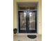 Elegant double front doors with decorative glass accents provide a warm and inviting entrance to the home at 4733 Spring Meadow Ln, Sarasota, FL 34233