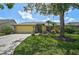 Well-maintained, single-story home featuring beautiful landscaping and a two-car garage at 4733 Spring Meadow Ln, Sarasota, FL 34233