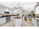 Large open kitchen with stainless steel appliances and a wine refrigerator at 4733 Spring Meadow Ln, Sarasota, FL 34233