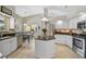 Spacious kitchen with granite countertops, white cabinets, and stainless steel appliances at 4733 Spring Meadow Ln, Sarasota, FL 34233