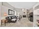 Open living room with neutral walls, travertine floors, fireplace, and built-in shelves at 4733 Spring Meadow Ln, Sarasota, FL 34233