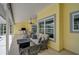 Inviting covered patio offering comfortable seating and outdoor living space at 4733 Spring Meadow Ln, Sarasota, FL 34233