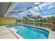 Relaxing pool area overlooking a pond, providing serene outdoor living experience at 4733 Spring Meadow Ln, Sarasota, FL 34233