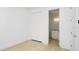 A bedroom with LVP flooring featuring a closet and bathroom entrance at 4796 Duncan Rd, Punta Gorda, FL 33982