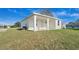Newly renovated single-story home with a covered patio and green lawn at 4796 Duncan Rd, Punta Gorda, FL 33982