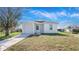 Charming one-story home featuring a well-manicured lawn, driveway, and a one car garage at 4796 Duncan Rd, Punta Gorda, FL 33982