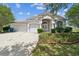 Charming single-story home featuring a well-manicured front yard and a two-car garage at 4915 Bookelia Cir, Bradenton, FL 34203
