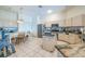 Bright kitchen with tiled floors, an island, and light-colored cabinetry and countertops at 4915 Bookelia Cir, Bradenton, FL 34203