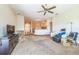 Open-concept living area with neutral carpet, arched doorways, and a view into the kitchen at 4915 Bookelia Cir, Bradenton, FL 34203
