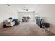 Spacious living room with carpet, a ceiling fan, and an arched window providing natural light at 4915 Bookelia Cir, Bradenton, FL 34203