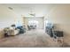 Open-concept living room with plenty of space and neutral carpeting at 4915 Bookelia Cir, Bradenton, FL 34203