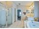 Bright main bathroom featuring a walk-in shower and soaking tub at 4915 Bookelia Cir, Bradenton, FL 34203