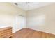 Cozy bedroom featuring warm wood floors, neutral walls and a ceiling fan for added comfort at 4957 Sabal Lake Cir, Sarasota, FL 34238