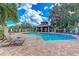 Community pool and cabana area, with plenty of seating, lush landscaping and shade at 4957 Sabal Lake Cir, Sarasota, FL 34238