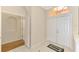 Foyer with double front doors, tile floors, and an arched transom window at 4957 Sabal Lake Cir, Sarasota, FL 34238