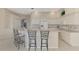 Spacious kitchen featuring a breakfast bar with seating and views to backyard at 4957 Sabal Lake Cir, Sarasota, FL 34238