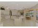 Well-lit kitchen with white cabinetry, modern appliances, and a breakfast nook overlooking the water at 4957 Sabal Lake Cir, Sarasota, FL 34238
